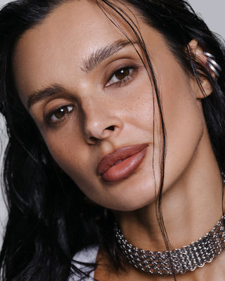 Close-up of Korolova wearing the Korolova x BiaBelle Lip Kit in a soft brown-nude lip shade